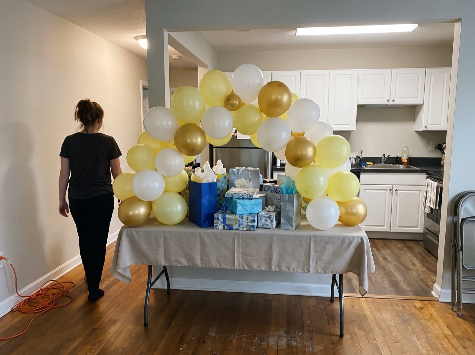 Mini tabletop balloon arch over a gift table
